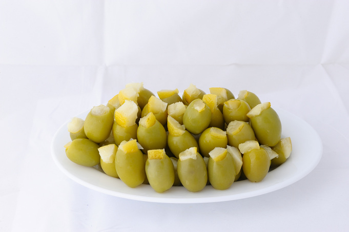 Green stuffed olives with lemon